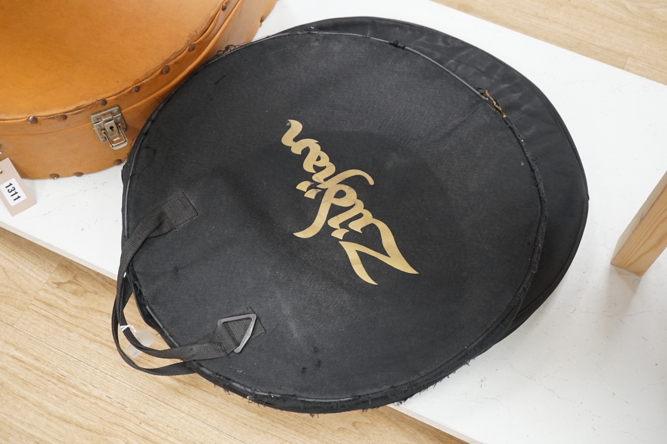 Four Zildjian drum kit cymbals; a 14” Top Quick Beat Hi-hat pair, a 16” Medium Thin Crash, an 18” Thin Crash and a 20” Ride Cymbal, within two cases